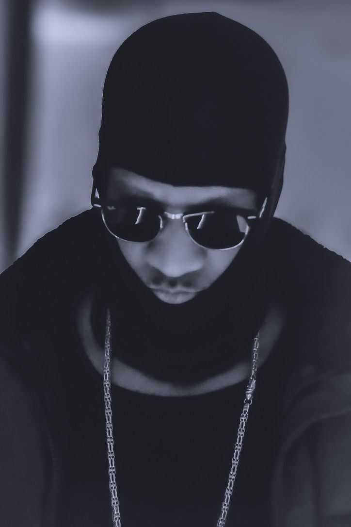 Black and white portrait of a man wearing sunglasses and a beanie, portrait photography
