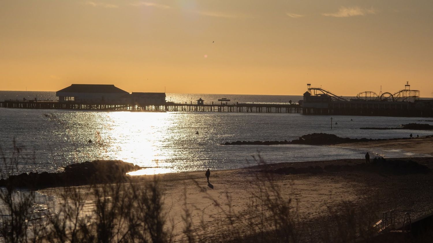 Pier and beach at sunset wall art print
