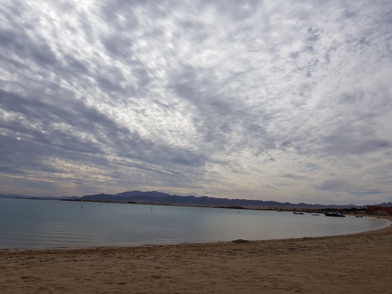 Dramatic cloudscape over a calm bay wall art print