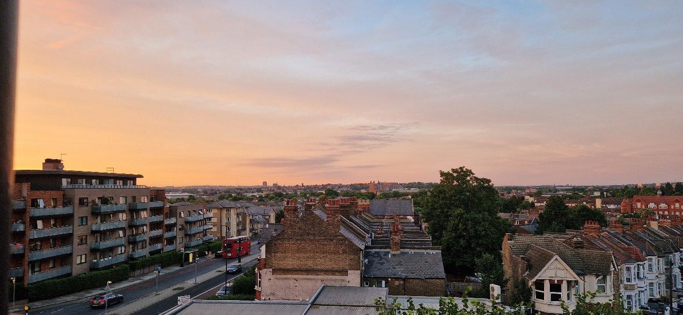 Sunset over rooftops wall art print