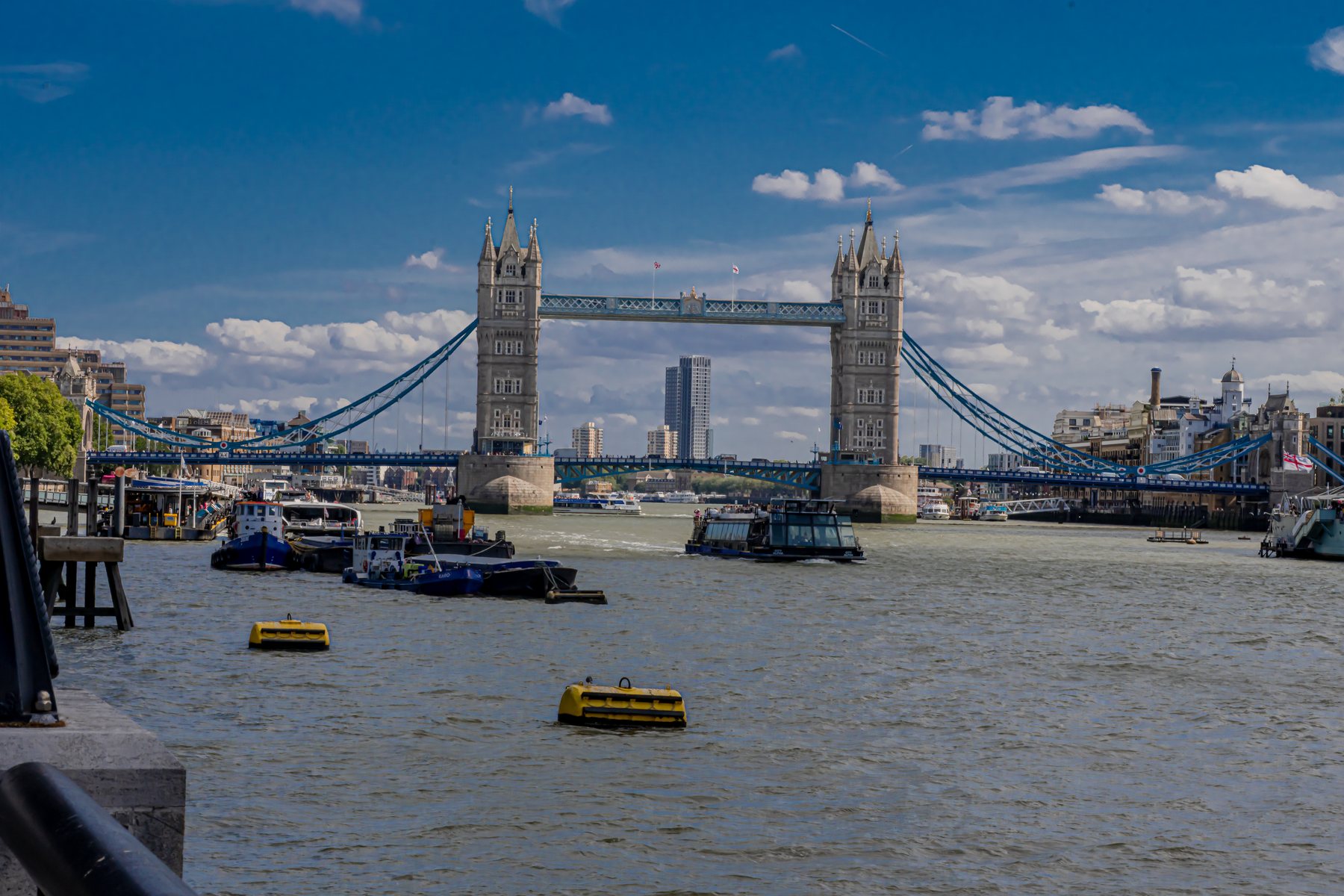 Tower Bridge viewed across the River Thames with boats, landscape photography, London