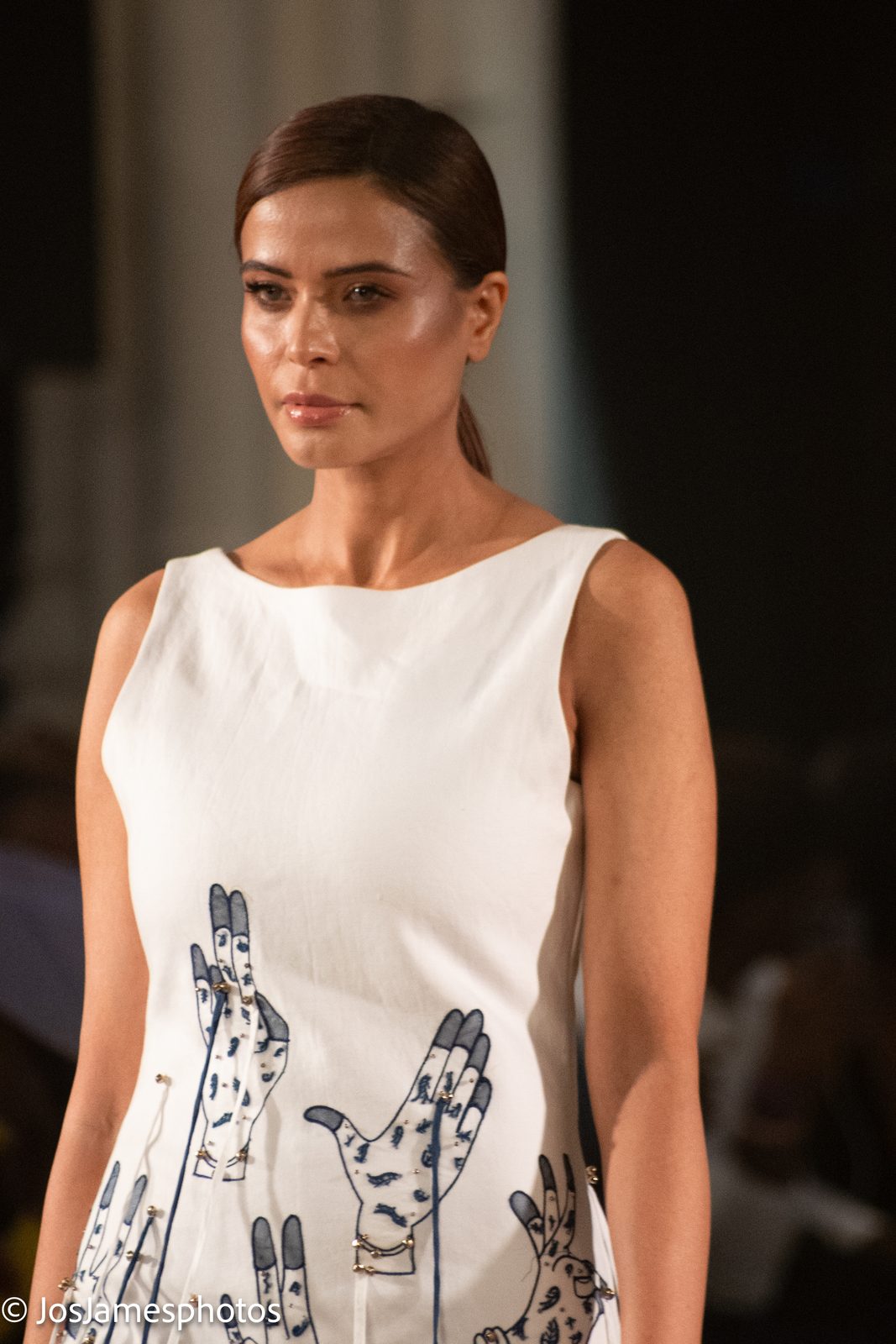 Model in a white printed dress on the catwalk, London Fashion Week 2026 event photography