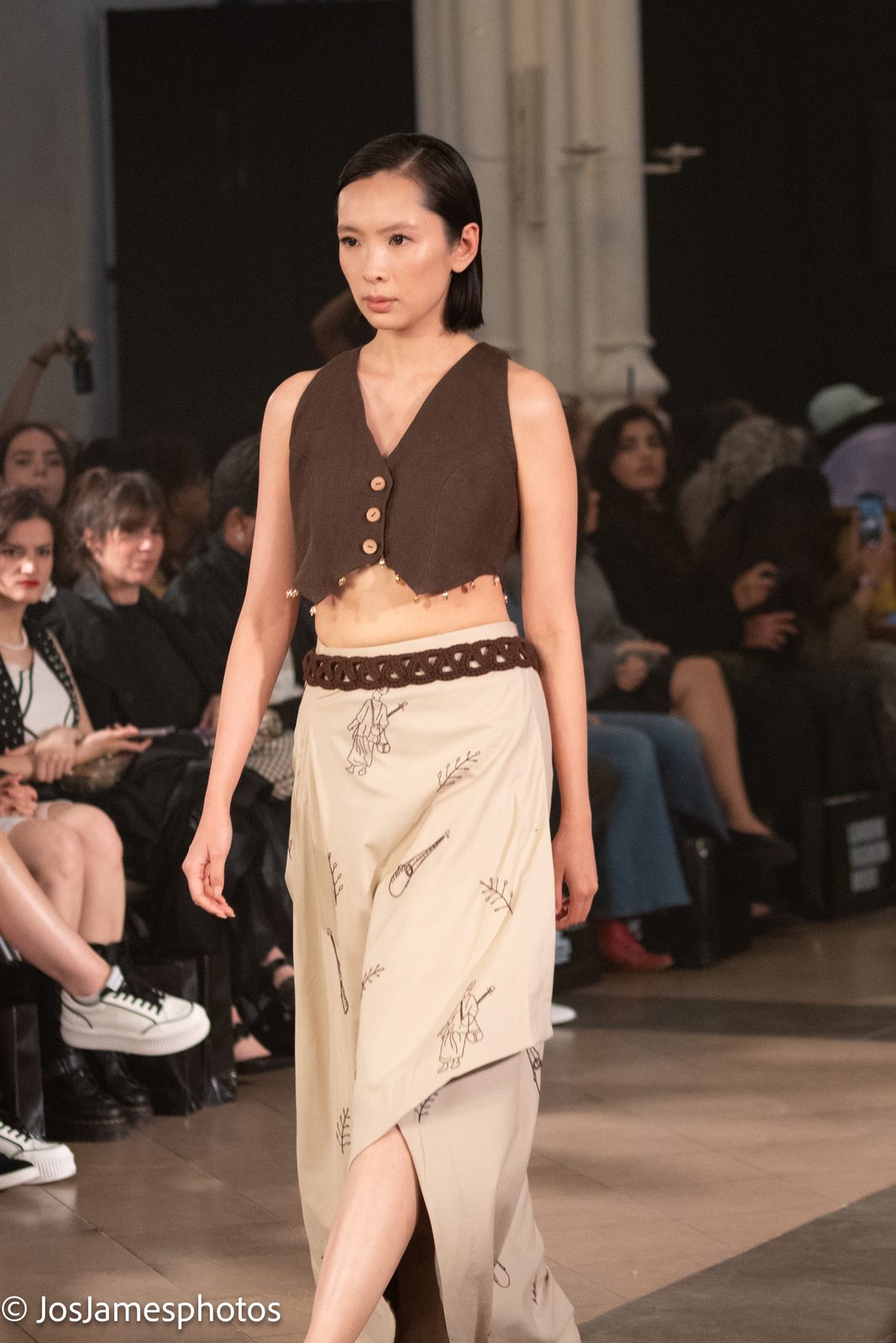 Model in a waistcoat and wrap skirt on the catwalk, London Fashion Week 2026