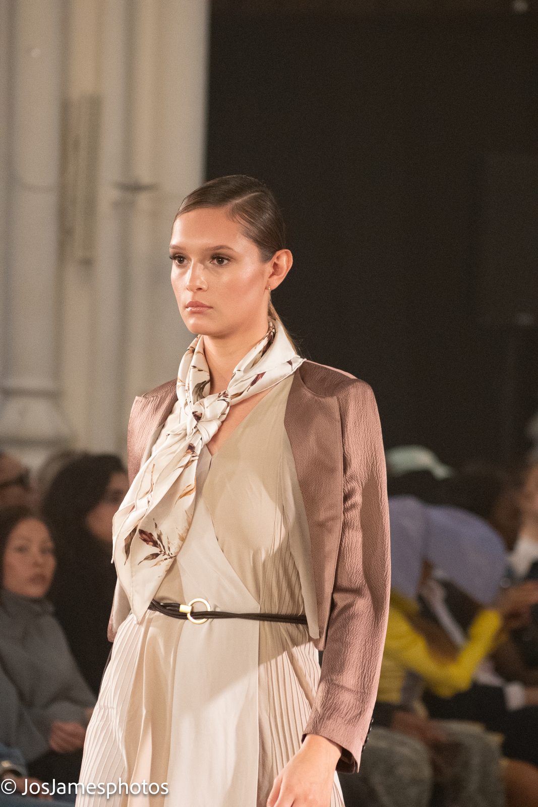 Model in a satin jacket and silk scarf on the catwalk, London Fashion Week 2026 event photography